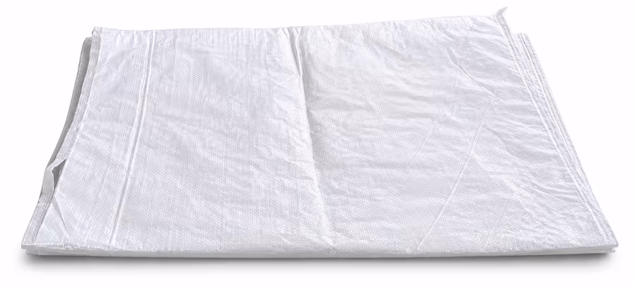 A folded white HDPE woven sack lying flat